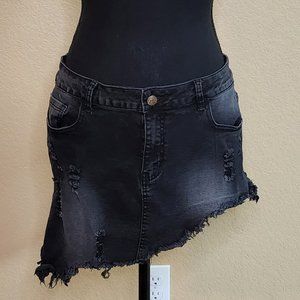 Short, assymetrical dark jean skirt.